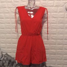 New Coral Red Jumper. With Size Xs With Bags Chic Red Jumpsuits And Rompers For Summer, Red Jumpsuits And Rompers For Spring Beach Outings, Red Jumpsuits And Rompers For Beach In Spring, Chic Red Jumpsuits And Rompers For Vacation, Casual Red V-neck Jumpsuits And Rompers, Casual Red V-neck Jumpsuit, Red Jumpsuits And Rompers With Pockets For Beach, Red Summer Jumpsuits And Rompers For Beach, Red Beach Jumpsuits And Rompers With Pockets