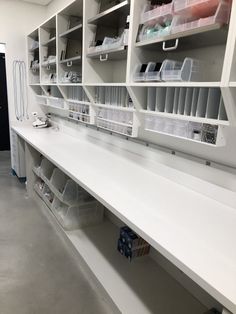 a room with shelves and bins filled with various items on it's sides