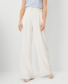 Our pleated wide leg pant is a modern must-have, with a perfect drape and high waist that endlessly flatters. Front zip with double hook-and-bar closure. Belt loops. Front pleats. Vertical on-seam pockets. Back besom pockets. Lined.,Leg Shape:Leg Shape: Wide Leg – a modern must-have with a statement leg and flattering high waist,Rise:High rise: sits 1/2" to 1" below natural waist,Imported:Imported,Fit:Fit: Relaxed & easy,Length:Full length: 32" inseam with 27" leg opening,Fabrication:92% Polyester, 8% Spandex,Garment Care:Machine Washable The Pleated Wide Leg Pant by Ann Taylor Size regular - 6 Winter White Women's Regular, Wide, Leg, Pants, 92%, Polyester, 8%, Spandex, Machine, Washable White Tailored Pants, White Pants Winter, White Trouser Pants, White Wide Leg Pants, White Dress Pants, White Clothing, Knitted Suit, White Trousers, Light Dress