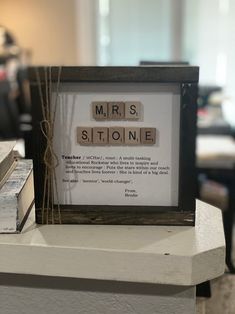 a crossword puzzle sitting on top of a table next to a stack of books