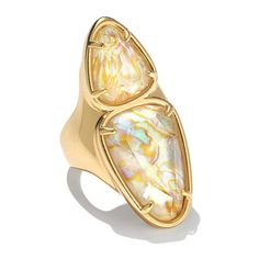 Kendra Scott Margot Double Gemstone Ring  An everyday head-turner, Margot features a modern, double-stone design that brings to mind shoreside pebbles. Give this versatile ring a whirl with daytime and night-out looks and explore lots of styling possibilities.        Approx. 1-9/19"L x 13/19"W; 3/16"W shank      Antiqued, matte finish     Color Information      Turquoise-Color Magnesite Earrings: Rhodium-plated silvertone metal     White Abalone Earrings: Gold-plated metal    Stone Information Abalone Earrings, Color Bands, Kendra Scott Jewelry, Stone Design, Turquoise Color, Blue Rings, White Ring, Kendra Scott, Piercing Jewelry