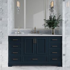 a bathroom vanity with two sinks and large mirrors on the wall above it is decorated in marble