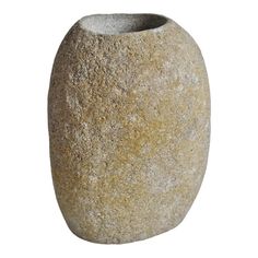 a close up of a stone vase on a white background