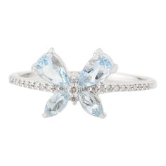 This is part of Chairish’s Fine Jewelry assortment.  Dainty Aquamarine Diamond Butterfly Ring in 18K Gold featuring natural aquamarine of 0.56 carats and diamonds of 0.06 carats. The gorgeous handcrafted ring goes with every style. Aquamarine is useful for moving through transition and change.  Designed with pear and marquise cut aquamarine set in center making a butterfly with diamonds set in center that makes it a perfect fit to wear it on your wedding or style it with any of your basic outfit Aquamarine Diamond Ring For Promise, Aquamarine Promise Ring With Diamond Accents, Diamond Butterfly Ring With Gemstone For Formal Occasions, Formal Diamond Butterfly Ring With Gemstone, Light Blue Diamond Ring With Brilliant Cut, Luxury Light Blue Rings For Anniversary, Light Blue Brilliant Cut Fine Jewelry Ring, Light Blue Diamond Ring With Accent Stones, Light Blue Diamond Rings With Accent Stones