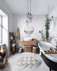 a bathroom with a tub, sink and mirror in it's centerpieces