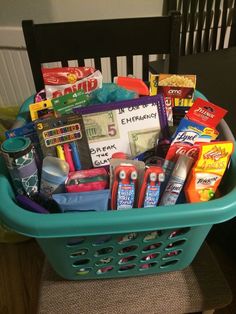 a basket filled with school supplies sitting on top of a chair