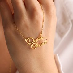 ❤️Perfect Gift for loved ones. ❤️DOUBLE NAME NECKLACE WITH HEART ❤️Your purchase will arrive in a gift box ❤️ All our jewelry is handmade with Love and Care in our workshop  DETAILS Material: High-Quality Solid 925 Sterling Silver  Finish: Silver Plated, Rose Plated, Gold Plated   PROCESSING & SHIPPING All items purchased will be shipped within 2-7 business days. You can upgrade your shipping to Express during check out if you want it faster 🚀Standard Shipping Time for the US: 2- 7 business days worldwide 🚀Express Shipping Time: 1-5 business days worldwide  ASSURANCE ✧ Nickel Free ✧ Tarnish Resistant ✧ High-Quality Materials ATTENTION PLEASE This necklace will be custom made especially for you by hand in our studio with love and care. We can't accept returns or exchanges on customised pi Name Necklace For Gift, Valentine's Day Gift Name Necklace With Letter Pendant, Valentine's Day Name Necklaces, Names Necklace For Anniversary Gift On Valentine's Day, Names Necklace For Anniversary, Valentine's Day Gift, Customized Name Necklace For Anniversary Gift, Personalized Name Necklaces For Anniversary On Valentine's Day, Personalized Name Necklaces For Valentine's Day Anniversary, Customized Necklace For Anniversary