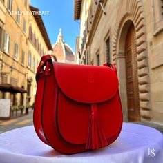 This bag has been made of the best genuine leather by local master crafters of Florence in Italy, designed for men who only accept premium Italian quality and luxury leather bags and modern Italian fashion. . Sizes: . Height: 23 cm (9.1 in) Width: 23 cm (9.1 in) Depth: 8 cm (3.1 in) Color: Red . The story of this bag: In the heart of Florence, where history whispers through cobblestone streets and artisans breathe life into their crafts, there stood a quaint workshop adorned with the scent of fi Leather Handbag Patterns, Leather Bags For Women, Handmade Leather Tote Bag, Handmade Leather Bags, Luxury Leather Bag, Handmade Leather Bag, Red Crossbody Bag, Wallet Design, Red Crossbody