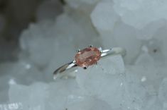 This is a absolutely stunning Oregon Sunstone set in Sterling Silver. Oregon Sunstone is one of the hottest gems on the market today with it's varying colors, patterns and just overall beauty. This particular Oregon Sunstone has a great peachy pink color with a decent shchiller effect! You will surely not be disappointed in this!! Depending upon the lighting, you may see shimmers of the copper shiller which is highly desired! This nicely sized 7mm x 5mm Oval Cut Oregon Sunstone weighs 0.385 cts Elegant Untreated Gemstones For Anniversary, Untreated Oval Sapphire Ring As Gift, Pink Gemstones In Fine Jewelry Style, Untreated Oval Elegant Gemstones, Morganite Topaz Ring, Classic Coral Jewelry As Gift, Tourmaline Sapphire Ring With Accent Stones As Gift, Elegant Untreated Oval Gemstones, Pink Gemstones With Accent Stones For Gift