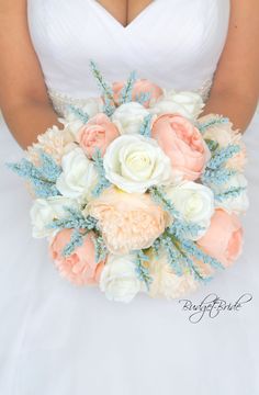 a bridal holding a bouquet of white and peach flowers