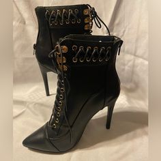 These Never Worn Faux Tie Spike Boots Will Definitely Make A Statement As You Walk Into The Room! They Have Faux Laces With Gold Accents, But Zip In The Back For Easy Access. Size 8 Trendy Lace-up Boots With Pointed Toe For Night Out, Trendy Lace-up Boots For Night Out, Edgy High Heel Lace-up Boots For Night Out, Trendy Ankle-high Lace-up Boots For Night Out, Fall Pointed Toe Lace-up Boots For Night Out, Ankle-high Lace-up Boots For Night Out In Fall, Lace-up Boots With Reinforced Heel And Pointed Toe, Fall Lace-up Boots With Pointed Toe For Night Out, Edgy Lace-up Heeled Boots For Night Out