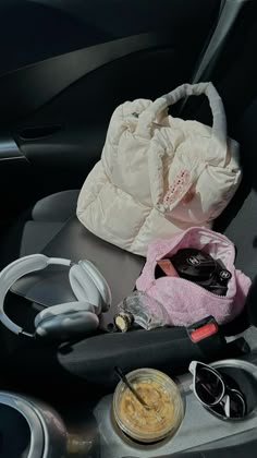 the interior of a car with various items in it