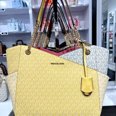 This Is So Feminine And Beautiful, It's Blurred Yellow And White Design Coated Canvas 90% Coated Canvas/10% Polyester Gold-Tone Hardware 15.75”W X 10.5”H X 4.75”D Handle Drop: 9.5” Exterior Details: Back Slip Pocket Interior Details: Back Zip Pocket, 2 Back Slip Pockets Lining: 100% Polyester Clip Fastening Yellow Shoulder Bag With Branded Hardware For Travel, Yellow Shoulder Bag For Daily Use With Dust Bag, Yellow Double Handle Shoulder Bag For Shopping, Yellow Shoulder Bag With Handles For Shopping, Yellow Double Handle Shopping Shoulder Bag, Yellow Tote Shoulder Bag With Dust Bag, Yellow Travel Bag With Branded Hardware, Yellow Shopping Bags, Yellow Shoulder Bag With Gold-tone Hardware For Errands