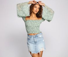 Pretty florals are on your radar. stun with a cute crop top! The crop top features an off-the-shoulder neckline. a smocked bodice with a floral print. chiffon bell sleeves. and a cropped hem with lettuce-edge trim. Complete look with high waist shorts and wedges for that next BBQ with the squad!Fit & Features Off the shoulder neckline Smocked bodice Floral print Long chiffon bell sleeves Cropped hem. lettuce-edge trim Form hugging fit. moderate stretch Runs true to size Homecoming Outfits, Cute Crop Top, Floral Print Chiffon, High Waist Shorts, Cute Crop Tops, Selling Clothes, Woven Top, Print Chiffon, High Waisted Shorts