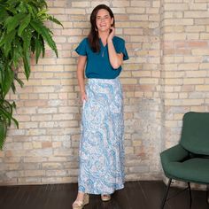 A summer essential, the Halle Maxi Skirt features a gorgeous amber floral pattern, comfortable elastic waistband, and pockets. This lightweight and easy to wear skirt will easily become your new favorite. Perfect as a boho summer skirt for women thanks to the soft flowing material and the soft color. Endless versatility and unfettered comfort make this the maxi skirt you'll reach for time and time again! On casual days, work days, nights out, date nights, to parties, this ankle length skirt will Long Paisley Print Skirt, Flowy Long Skirt With Paisley Print, Long Flowy Skirt With Paisley Print, Flowy Long Paisley Print Skirt, Spring Paisley Print Flowy Maxi Skirt, Spring Flowy Maxi Skirt With Paisley Print, Casual Paisley Print Flowy Skirt, Casual Long Skirt With Boho Print, Summer Paisley Print Long Skirt