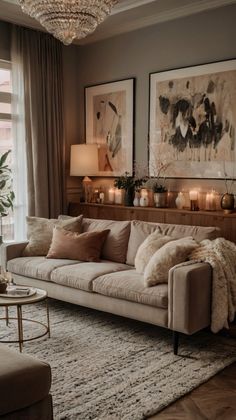 a living room filled with lots of furniture next to a large window covered in candles