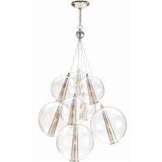 six clear glass globes hanging from a ceiling fixture