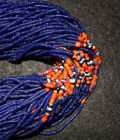 "Necklace 568. Authenic Vintage Konyak Naga Long Navy Blue \"Royal\" Glass Bead Necklace with Special Shell Button Clasp. Has special beads added in the center and added chank shell button for status. The piece has 84 strands of beads, is 36\" long and has a very special beaded clasp with a chank shell button. Excellent condition for its age estimated to be early to late 19th century. Please note that the designation \"Authentic\" means that the piece was made by the Nagas and used by them in th Traditional Hand-strung Blue Necklace, Artisan Hand-strung Blue Beaded Necklace, Artisan Blue Polished Beads, Traditional Large Blue Beads, Traditional Blue Beaded Necklaces With Colorful Beads, Blue Traditional Beads For Jewelry Making, Traditional Blue Beads For Jewelry Making, Traditional Blue Oval Bead Necklaces, Traditional Blue Oval Beads Necklaces