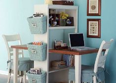 a computer desk with baskets on top of it and an open book shelf next to it