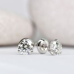 These timeless and elegant stud earrings are a true staple in any girl's jewelry box! 3 prong "cocktail style" setting Set with stunning lab grown diamonds Choose your center lab grown diamond: Better: an eye-clean diamond that's very slightly warm in color (SI+ clarity, GHI color) Best: an impeccable diamond, that's completely colorless (VS+ clarity, DEF color) Earrings weighing 1.00ct (total per pair) or above are crafted with threaded screw back posts, to ensure you never loose them. You're w Minimalist Brilliant Cut Round Diamond Earrings, Minimalist Round Cut Brilliant Diamond Earrings, Classic Platinum Solitaire Diamond Earrings, Classic Formal Earrings With Tension Setting, Timeless Lab Grown Diamond Earrings With Prong Setting, Timeless Lab-grown Diamond Earrings With Prong Setting, Elegant 14k White Gold Earrings With Single Diamond, Timeless 14k White Gold Diamond Earrings, Timeless 14k White Gold Vvs Clarity Diamond Earrings