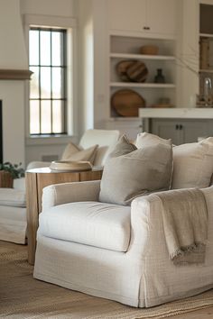 Elegant and cozy farmhouse living room featuring neutral tones, comfortable furniture, and tasteful decor, creating a warm inviting space.