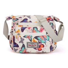 PRICES MAY VARY. Super practical: Made of practical water resistant and stain resistant nylon fabric that is durable lightweight high quality construction, easy to care for wipe clean or machine wash Size: 10.6 x 7.8 x 9.8 inches(25cm*23cm*11cm) Adjustable shoulder strap, smooth zipper. Unique printing floral pattern,be unconventional and make an individual statement of fashion Large capacity: Large capacity with 1 inner zipper pocket, 3 front pockets, 2 side pockets. This bag fit in quite a bit Waterproof Crossbody Bag, Denim Handbags, Women Crossbody Bag, Floral Bags, Travel Handbags, Handbag Straps, Pocket Bag, Retro Chic, Nylon Bag