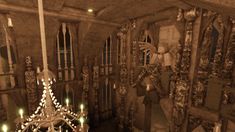 an artistic photo of a chandelier in a gothic - style setting with candles lit