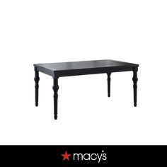 a black table with legs and a star on the bottom that says macy's