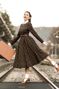 Thanks for @rou_quette wear the plaid wool dress. This plaid dress is suitable for all occasions, and the vintage plaid elements will make you love it even more. Great for fall and winter, fit and flare, and can be made to fit you as well! DETAIL * 30% wool, 30% fiber, 40% polyester * fully satiny lining, more nice to the touch body * Crew neckline * Long sleeves dress * Fit and flare dress * Back zipper closure * Two side seam pockets * Midi wool dress, Long wool dress * Plaid wool dress, Retro Long Sleeve Brown Plaid Dress For Fall, Retro Plaid Winter Dresses, Vintage Plaid Dress For Fall, Vintage Plaid Winter Dress, Vintage Plaid Dress For Winter, Plaid Tweed Dress For Fall, Retro Winter Workwear Dresses, Winter Plaid Dress For Workwear, Fitted Brown Plaid Dress For Fall