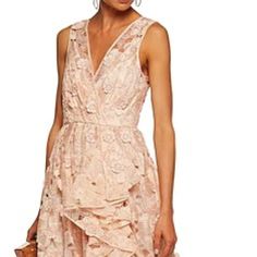 Nwt. Unworn. Absolutely Stunning. Badgley Mischka Evening Gown In Floral Lace With 3d Floral Detail. Asymmetric, Cascade Ruffle Detail Through Left. Surplice Neckline; V'd Back. Sleeveless; Tapered Straps. Peach Color. Column Silhouette. Zip At Lower Back. Polyester; Nylon Lining. Imported. Feminine Evening Dress For Spring Wedding, Pink Ruffled Gown For Cocktail, Feminine Floor-length Ruffled Evening Dress, Feminine Spring Evening Dress With Ruffles, Spring Feminine Evening Dress With Ruffles, Feminine Sleeveless Evening Dress For Wedding Guest, Glamorous Spring Gown With Ruffles, Pink Ruffled Evening Dress For Wedding Guest, Spring Wedding Evening Dress With Ruffles