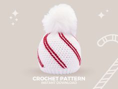 a crochet hat with a candy cane on the side