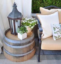 two chairs and a table with plants on it