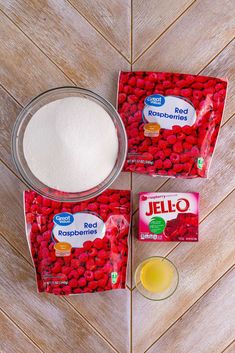 two bags of jello sitting on top of a wooden floor