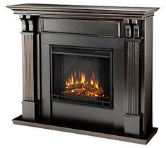 a black fireplace with flames in it