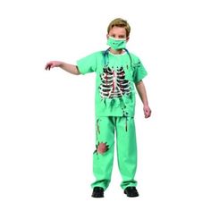 a young boy wearing a green skeleton shirt and matching scrubs, with his hands out to the side