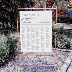 a sign that says our favorite people on it in front of some plants and bushes