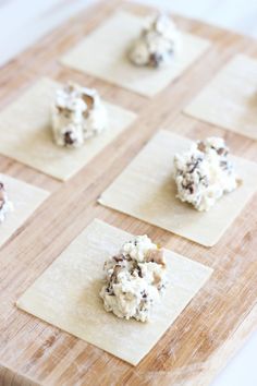 cookies and cream are sitting on top of dough