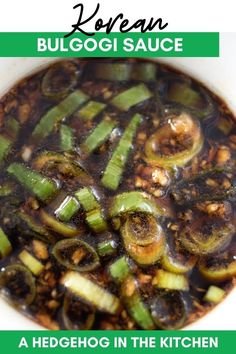 a white bowl filled with vegetables and sauce