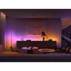 the living room is lit up with purple lighting and modern furniture, including a coffee table