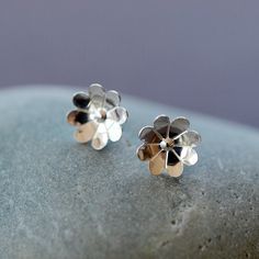 Reminiscent of the sweet flowers of the Chamomile plant, these cupped floral stud earrings are crafted entirely of sterling silver. These sweet silver post earrings are perfect for everyday wear. The face of the flower measures 1cm in diameter. The earrings come with sterling silver wingnut backs, as shown. Sterling Silver Flower Charm Earrings For Anniversary, Sterling Silver Birth Flower Earrings, Dainty Silver Birth Flower Earrings, Delicate Sterling Silver Birth Flower Earrings, Silver Flower Earrings With 3d Flowers For Gift, Silver Flower Earrings With 3d Flowers As Gift, Silver 3d Flower Earrings For Gifts, Silver 3d Flower Earrings, Sterling Silver Earrings With 3d Flowers