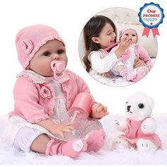 a baby doll is sitting next to a teddy bear and holding a toothbrush in it's mouth