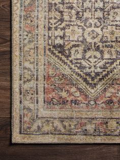 an antique rug on a wooden floor