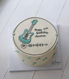 a birthday cake decorated with an electric guitar