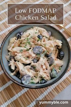 a bowl filled with chicken salad on top of a table