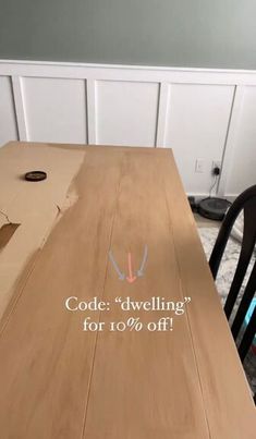 a wooden table with the words code d'dwelling for 10 % off on it