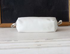 "The rectangular pencil case in white soft sheep leather. This pencils case was made to carry around your purse. Customize it in fabric or leather in your favorite color combination and why not mix and match it with one of the other bags in my shop http://etsy.me/1haNFVO Inside the bag, the lining is made using a cotton floral fabric. The top closes using a nylon zipper with silver colored hardware. Aprox. dimensions: The bottom is measuring 7\" x 5\" (18cm x 5cm) and the height of this pouch is White Zipper Pouch Pencil Case For Daily Use, White Pencil Case With Pen Holders For Everyday Use, White Pencil Case With Zipper, White Pouch Pencil Case For Daily Use, White Zipper Pouch Pencil Case, White Zipper Pouch Pencil Case For Everyday, White Rectangular Zipper Pencil Case, White Rectangular Pencil Case With Pen Holders, White Rectangular Pencil Case For Everyday Use