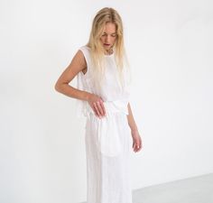 "RILEY is a wide leg cropped linen culottes. DETAILS - Cropped length - Seam pockets - Wide leg - Elasticated waist - 100% lightweight European linen fabric - Cut and sewn to order just for you in our studio COLOR - White (slightly see through), you can also choose other colors above - Fabric samples are available here https://www.etsy.com/listing/586569696/linen-fabric-samples SIZING & FIT - Fits true to size - Length is approximately 35.5 inches / 90 cm - Waist is approximately 13 inches / Cropped Summer Bottoms For Daywear, White Cropped Bottoms For Daywear, White Linen Wide Leg Pants For Daywear, Summer Cropped Bottoms With Loosely Fitted Hips, Relaxed Fit Linen Cropped Bottoms, Relaxed Fit Cropped Linen Bottoms, Linen Culottes, White Linen Trousers, Trousers White