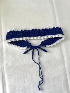 Navy blue and white hair band crocheted with care and passion. If you have any questions, I remain available! Crochet Navy Blue, Hair Band Crochet, White Hair Band, Crochet Hair Bands, Blue And White Hair, Dark Blue Crochet, Crochet Hair Band, Navy Blue Crochet, Bandeau Au Crochet