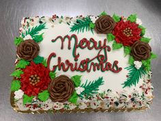 a decorated christmas cake sitting on top of a table