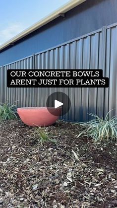 a red boat sitting in front of a building with the words, our concrete bowls aren't just for plants